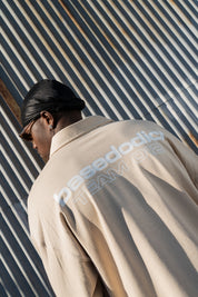 Polo Longsleeve "NEW MONEY" Team012 Beige/White